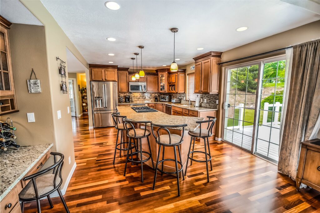 pexels photo 534151 534151 A luxurious modern kitchen featuring hardwood floors and granite countertops.